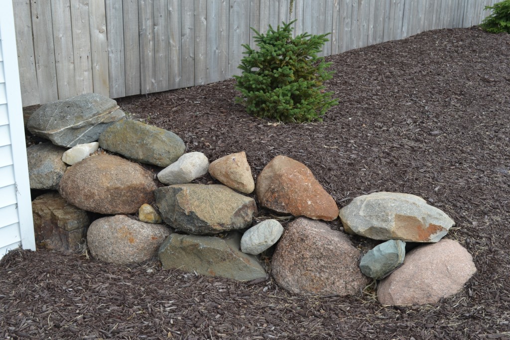 Boulder accents can dress up your landscape beds.